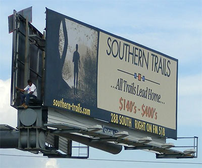 Southern Trails Billboard with Man Inside, Downtown Houston