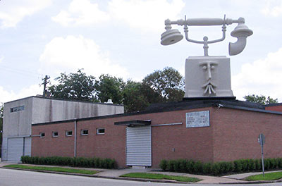 Big Alex, Telephone Sculpture by David Adickes, on Roof of Pictures Plus Prints and Framing, 115 Hyde Park Blvd., Montrose, Houston