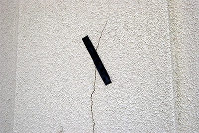 Close-Up of Crack in Stucco and Electrical Tape Repair, Circuit City, 4500 San Felipe St., Uptown, Houston