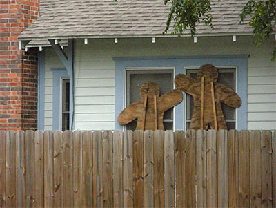 Plywood Yard Gingermen from Christmas Recycled as Hurricane Ike Shutters, Houston Heights