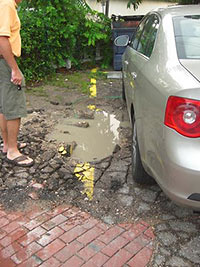 Pothole in Parking Lot for Hobbit Cafe, Blue Fish House, and Yelapa Playa Mexicana, 2241 Richmond Ave., Upper Kirby, Houston